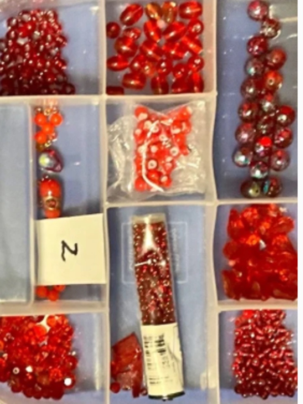 Jewelry making storage cases filled with beads, crystals, faceted, crystals +